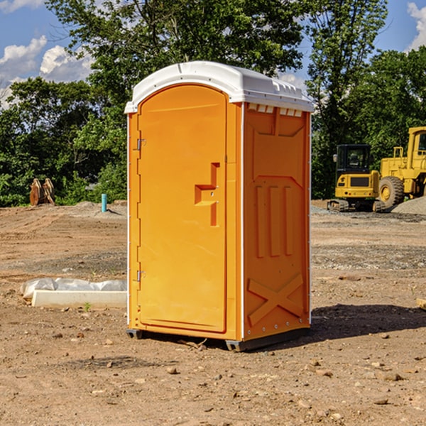 what is the cost difference between standard and deluxe portable restroom rentals in Rowan